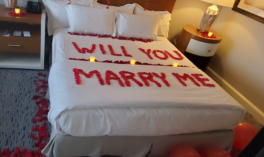 engagement proposal hotel room decoration